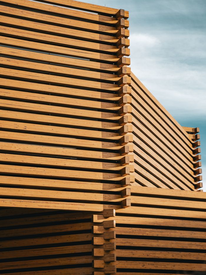 Close-up of wooden slatted architecture in Türkiye showcasing geometric design and natural materials.